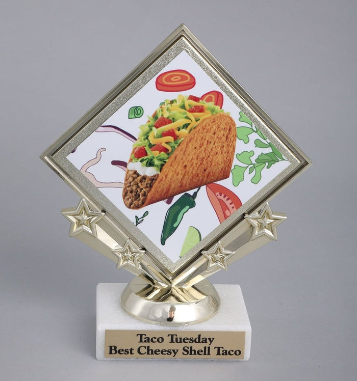 Diamond Taco Logo on star holder on white marble base with gold engraving plate